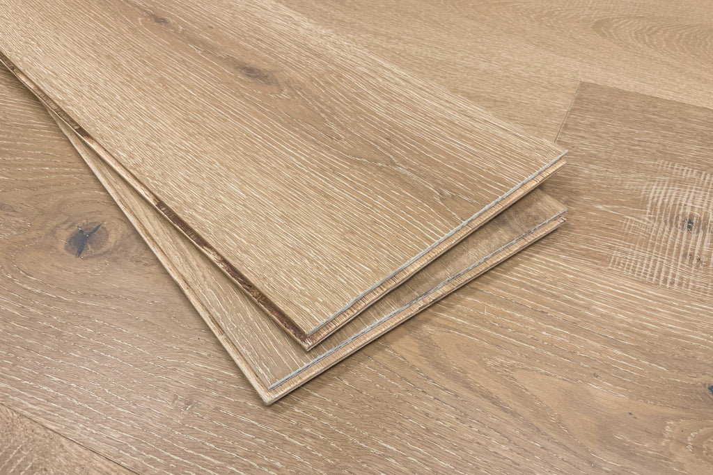 European Oak engineered wood flooring/hardwood/ABCD grade/4 mm top layer/4 mm wear layer/multi-layer core/medium shade/wirebrushed surface/matte finish/beveled edges/glue down installation/nail down installation/concrete subfloor/plywood subfloor/wood acclimation/CARB compliant/Floorscore/EPA/lifetime warranty/beige color/radiant heat compatible/UV lacquer finish/random length/rustic/4 Sided Tongue & Groove/janka hardness rating/oak/living room floor/dining room floor/basement floor/floor wood species